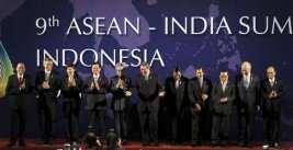 India's PM Singh poses for photo session with ASEAN leaders during the ASEAN and India Summit in Nusa Dua, Bali